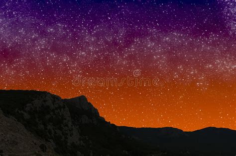 Mountains At Night On The Background Of Starry Sunset Sky Stock Image