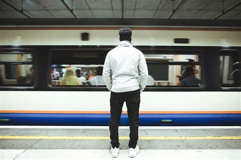 Download Premium Image Of Man Watching As The Train Goes By 532300