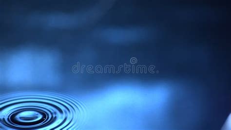 Slow Motion Water Drop Splash Into Calm Water Shot With Ultra High