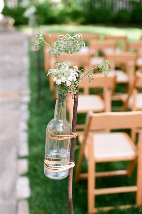 Decorate a set of three wine bottles with different white accents for an eclectic grouping of vases. 7 Wine Bottle Decor Ideas to Steal For Your Vineyard ...