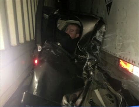 Incredible Story Behind Photo Of Guy Pinned Between 2 Semi Trucks