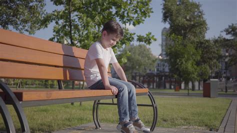 Lonely Child On Park Bench Enjoying Outdoor Stock Footage Sbv 336748338