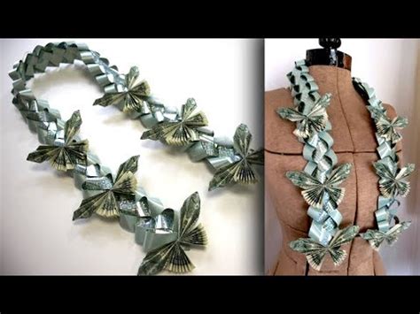 Fold it in half one more time. How to make flat money leis, MISHKANET.COM