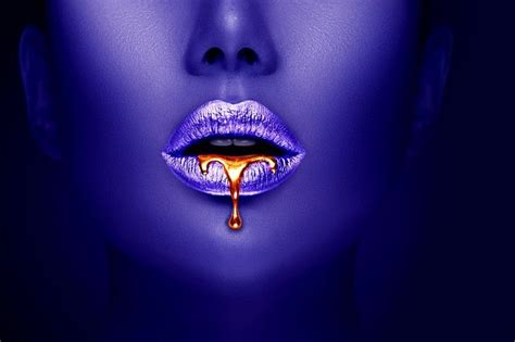 A Woman S Lips Are Covered In Purple And Gold Dripping From The Top Lip