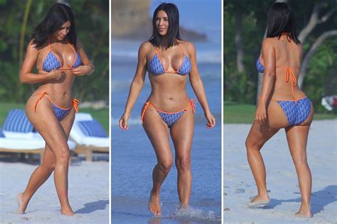 kim kardashian slips into another bikini and reveals her hourglass curves in new holiday snaps