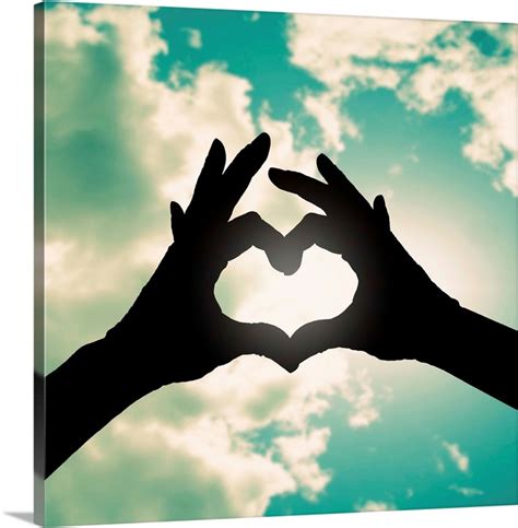 Two Hands Making A Heart Shape In The Sky Wall Art Canvas Prints