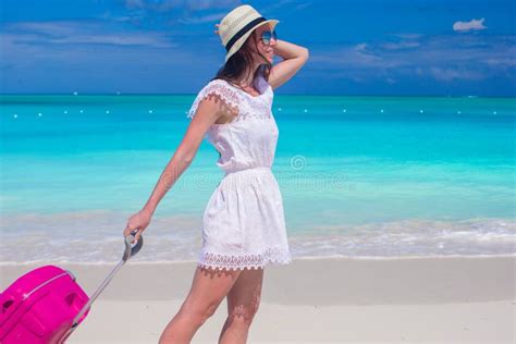 Young Beautiful Woman Walking With Her Luggage On Tropical Beach Stock