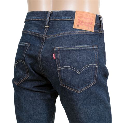 Faded And Creased Blue Denim Jeans By Levis Clothing