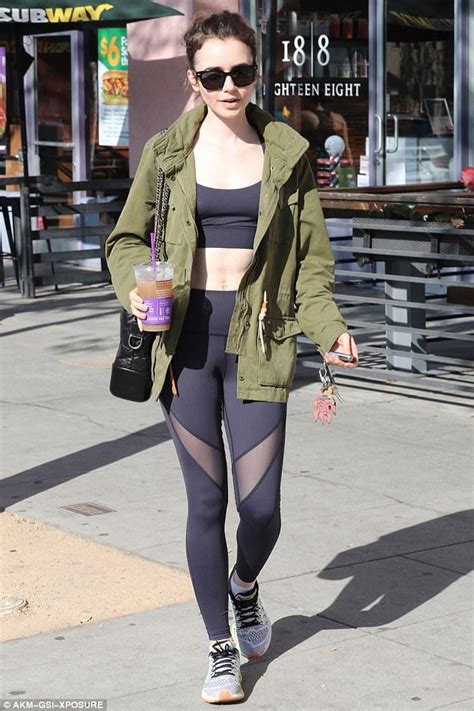 Lily Collins Flaunts Her Taut Tummy In Sports Bra After Visiting Gym