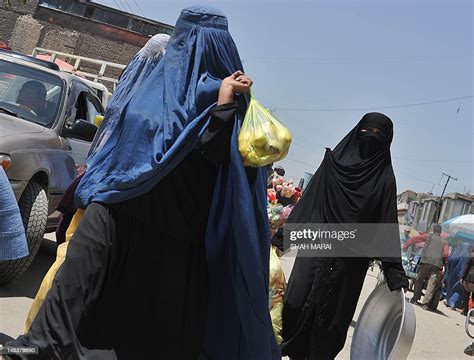 Two Burka Clad Afghan Women Waslk Through A Market In Kabul On May News Photo Getty Images