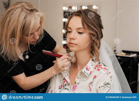 Shooting In A Beauty Salon Makeup Artist Makes A Wedding Makeup For A Young Girl Stock Image