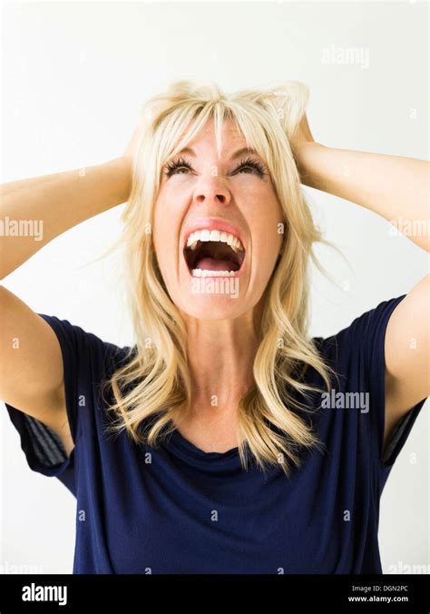 Studio Portrait Of Blonde Woman Screaming Stock Photo Alamy