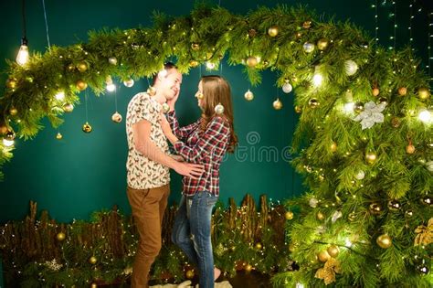 Couple In Love Near Christmas Background Young Couple Kissing Near