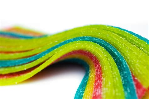 Rainbow Sour Jelly Candies Strips In Sugar Sprinkle On White Background
