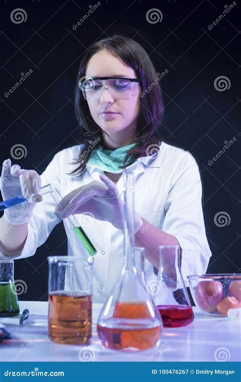 Laboratory Assistant In Protective Gloves During Scientific Experiment
