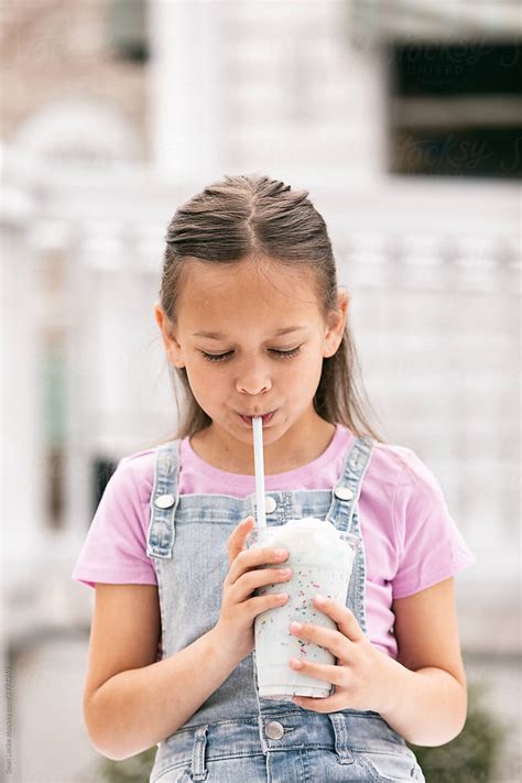 Babe Girl Enjoying A Milkshake By Stocksy Contributor Sean Locke Stocksy
