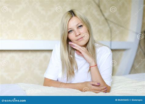 Charming Blonde Smiles And Poses For Camera Located In Sleeping Stock Image Image Of Face