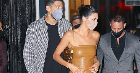 Finally, on valentine's day, the couple made their jenner shared a snap on her story of the phoenix suns player snuggling her as as she smiled happily. Kendall Jenner Brown Vegan Leather Outfit With Devin Booker | POPSUGAR Fashion