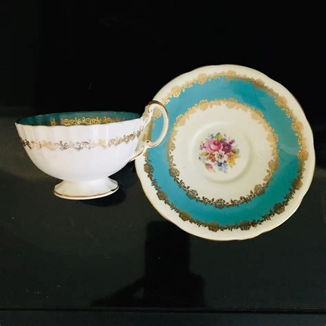 Aynsley Tea Cup And Saucer Turquoise Blue Floral Center Pattern Fine Bone China England