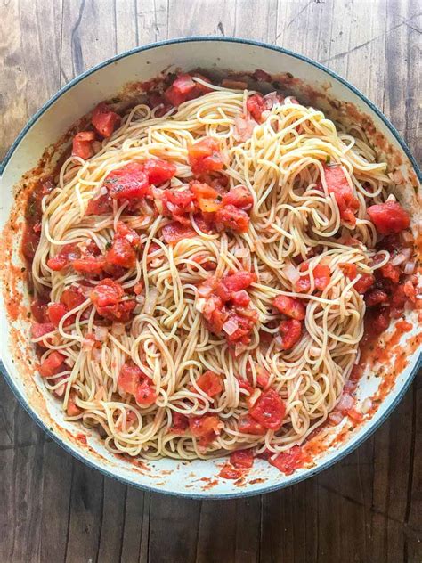 Angel hair pasta with olive oil, garlic and parmesan cheese. Pasta Pomodoro | Olive Garden Copycat Recipe | Life's Ambrosia