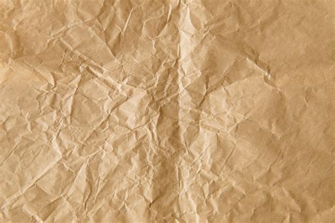 Premium Photo Crumpled Brown Paper Textured Background