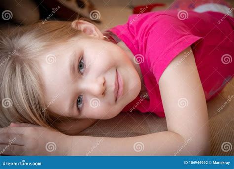 Closeup Image Of A Dreaming Smiling Beautiful Little Girl Stock Photo
