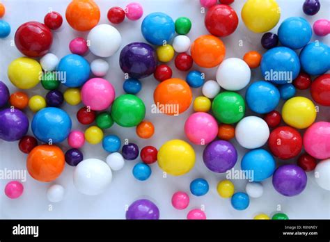 Bright And Colorful Multicolored Gumballs In Varying Shapes And Colors