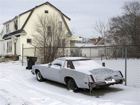 20 Photos Of Cars And Dealerships In Detroit That Were Left Behind