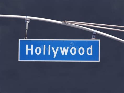 Hollywood Blvd Overhead Street Sign With Dark Storm Sky Stock Photo
