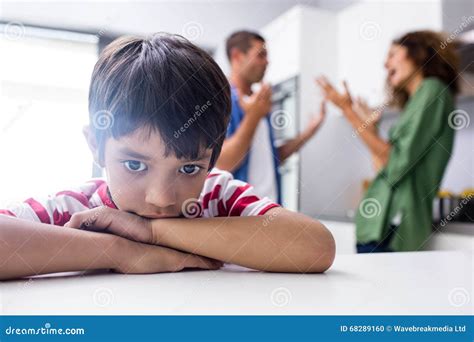 Boy Feeling Sad While His Parents Quarrelling Stock Photo Image Of