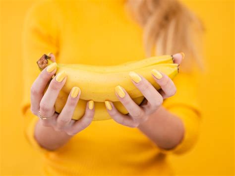 Free Photo Close Up Woman Holding Bananas