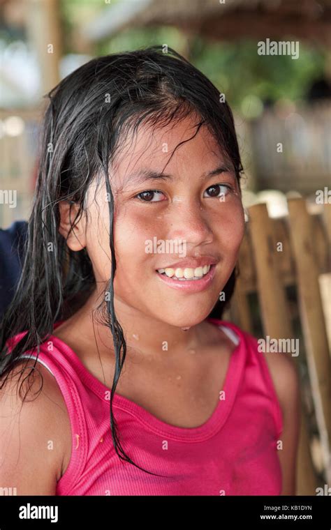 Portrait Of A Twelve Year Old Filipino Girl With Long Black Hair And