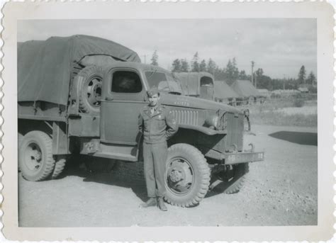 Ddr Densho 296 219 — A Serviceman Standing Next To A Truck Densho