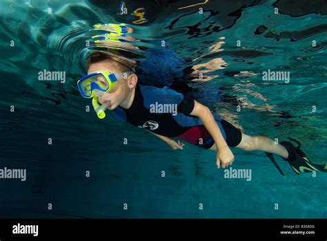 Boy Swimming With Snorkel In Pool From Underwater Stock Photo Alamy