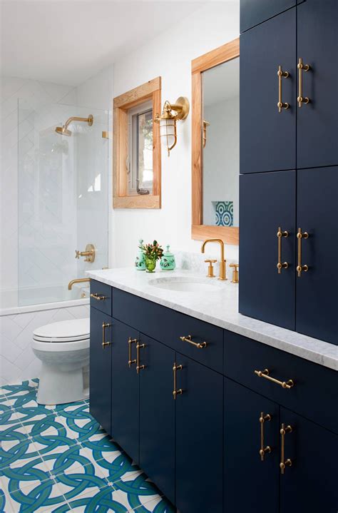 Our favorite element of this design scheme is actually the brass drawer pulls and door handles, and how nicely they pop against the navy wood. The 5 Bathroom Colour Trends Of 2020 - Inspiration | Lick
