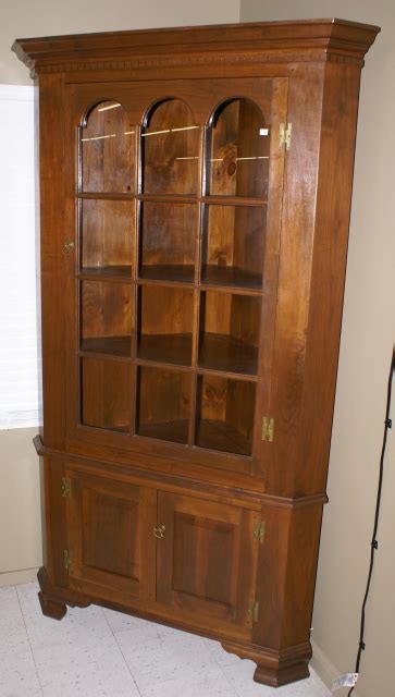 Maybe you would like to learn more about one of these? Solid walnut 2 piece custom made corner cabinet
