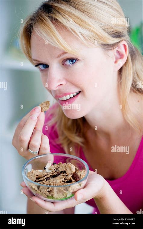 Woman Eating Breakfast Stock Photo Alamy
