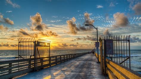 1920x1080 Beach Ocean Pier Nature Sunset Clouds Coolwallpapersme