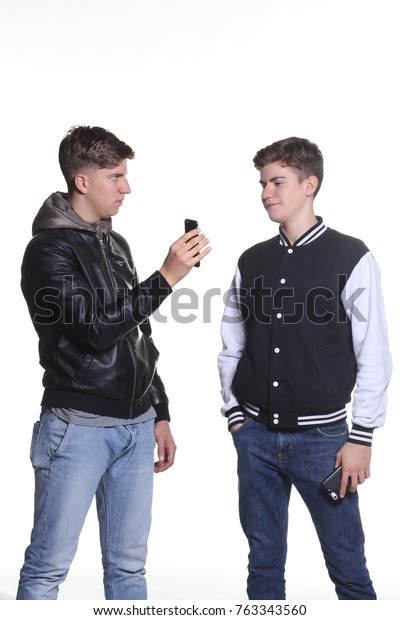Studio Portrait Two Boys Using Smatphone Stock Photo 763343560
