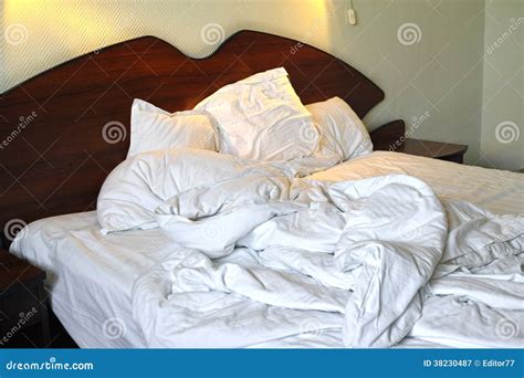 Messy Unmade Bed In Hotel Room Royalty Free Stock Photography Image