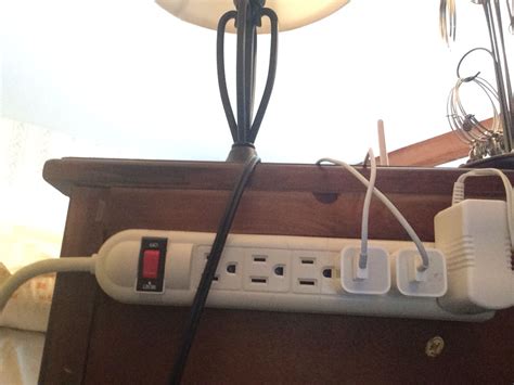 Velcro The Power Strip To The Back Of The Bedside Table No More