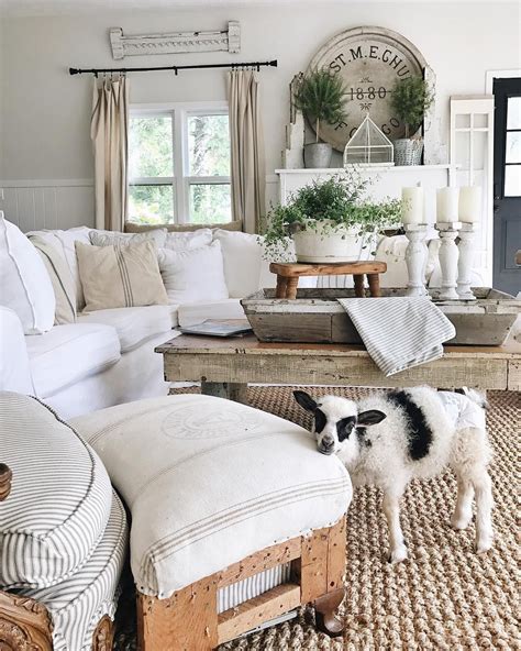 Here are 100 perfect farmhouse living rooms for your inspiration. Neutral colors, jute rug, vintage cricket stool, ticking ...