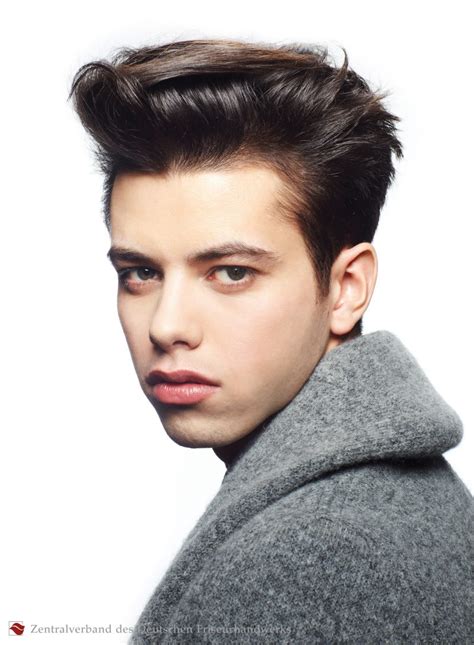 To transform your lifeless and straight strands into edgy tresses, this wispy haircut is a smart pick. Men's haircut with slicked back sides and a 50s quiff