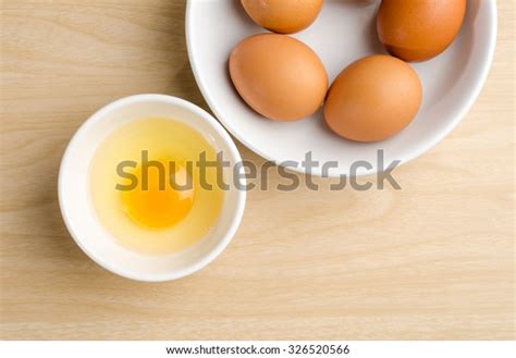 Fresh Egg Yolk Bowl On Wooden Stock Photo Edit Now 326520566