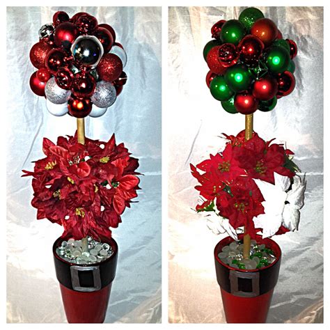 Two Vases With Christmas Decorations In Them