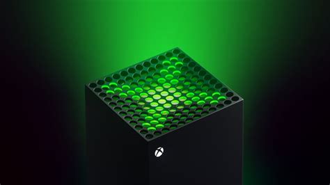 A Black Box With Green Lights On The Top And Bottom Part Is Lit Up In