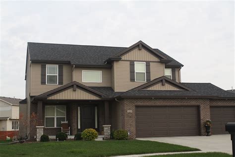 Pictures Of Houses With Stone Brown Siding And Black Gutters Or Trim