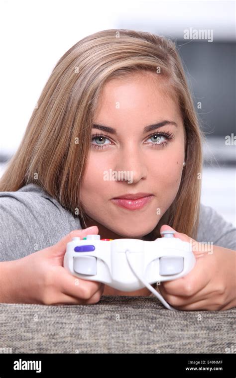 Teenage Girl Playing On Games Console Stock Photo Alamy