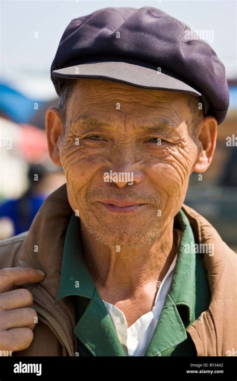 Old Man In Cap In Menghai Produce Market Yunnan Province