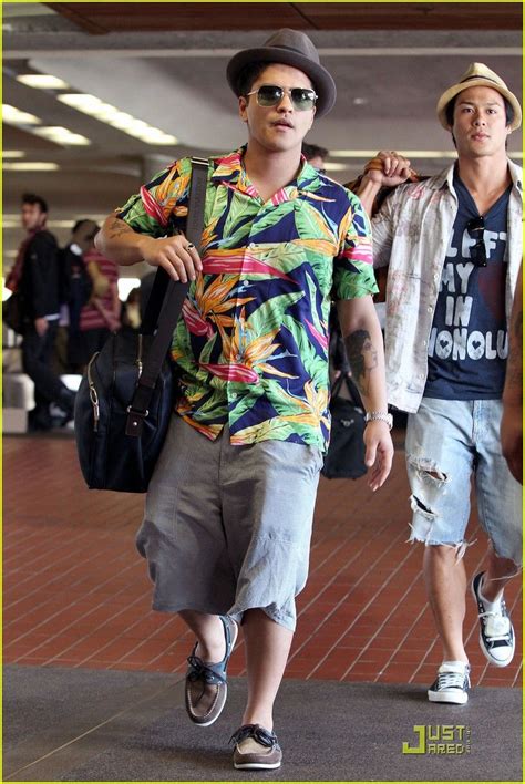 Bruno Mars Landing In Hawaii Dressed In An Aloha Shirt And Shades